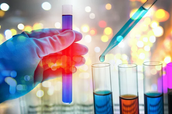 Double exposure of scientist hand holding laboratory test tube — Stock Photo, Image