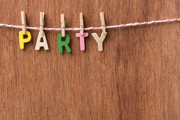 Wood text PARTY hanging with clothespins — Stock Photo, Image