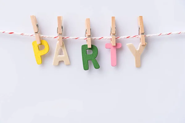 Wood text PARTY hanging with clothespins — Stock Photo, Image