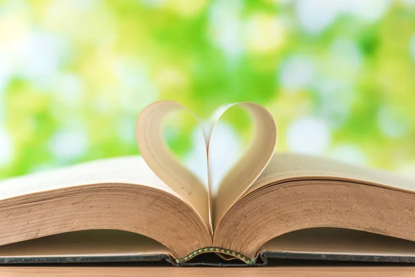 Love heart sign on vintage books — Stock Photo, Image
