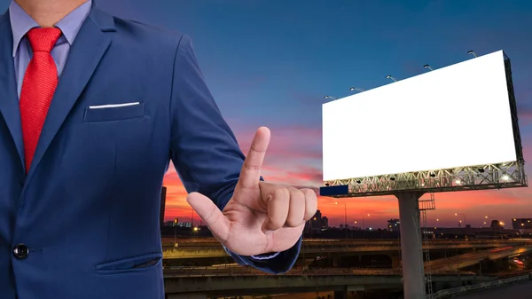 Businessman and blank billboard at twilight sky sunset ready for — Stock Photo, Image