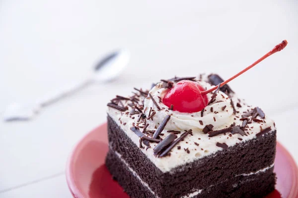 Black forest cake with fresh cream on white table Stock Photo