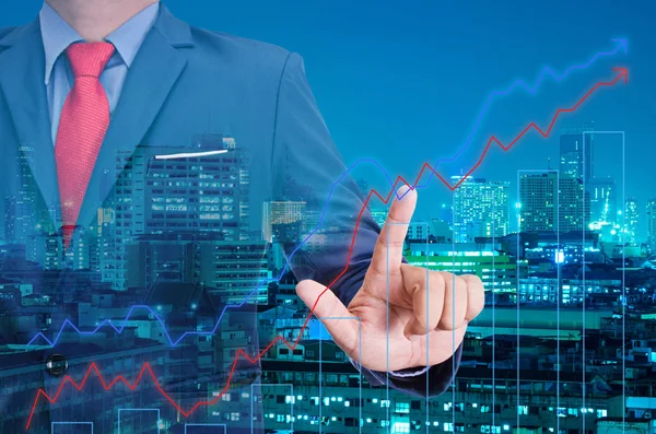 Businessman point on virtual graph on screen with night modern c — Stock Photo, Image