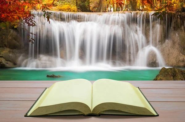 Open book with beautiful autumn waterfall in deep forest — Stock Photo, Image