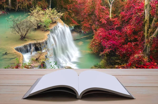 Open book with beautiful autumn waterfall in deep forest — Stock Photo, Image