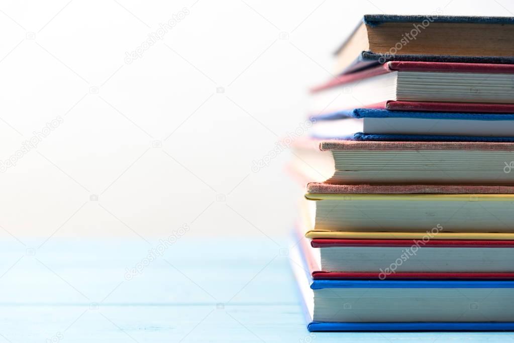 book stack on blue wooden table