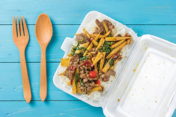 Rice topped with stir-fried beef and basil in a form box — Stock Photo, Image