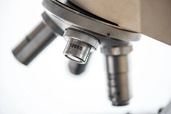 Close up of microscope len on white background — Stock Photo, Image