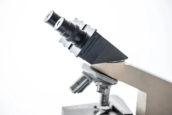 Close up of microscope len on white background — Stock Photo, Image