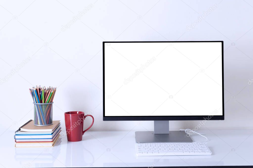 computer monitor on white table  work space background