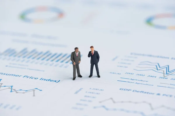 Business miniature people on business graph — Stock Photo, Image