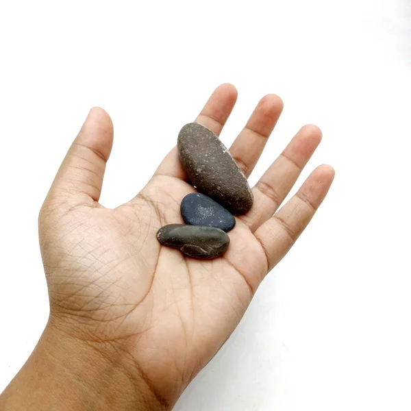 Hand hält Stein auf weißem Hintergrund — Stockfoto