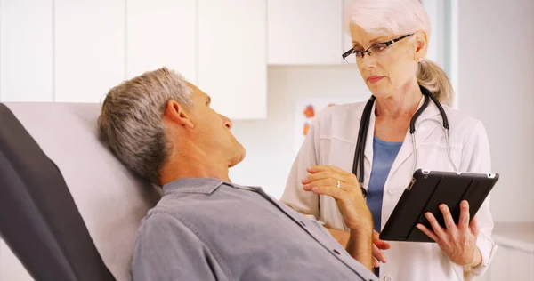 Senior Woman Doctor Talking Elderly Man Patient Office — Stock Photo, Image