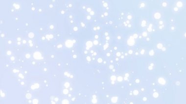 Üzerinde bir ışık mavi degrade arka plan hareketli ışıltılı beyaz kar taneleri