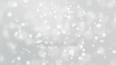 Gümüş beyaz bokeh arka plan ile titreşen ışıklar