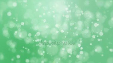 Işık bokeh parçacıkları ile yeşil arka plan