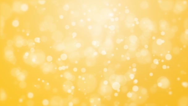 Sfondo giallo incandescente con particelle di luce — Video Stock