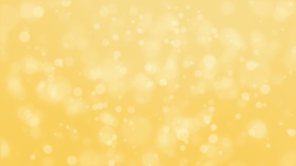 Beau fond bokeh jaune doré brillant avec des particules de lumière flottantes .