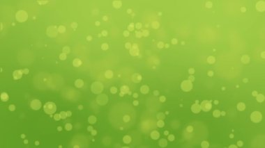 Bokeh ışıklar yüzen ile yeşil sarı renkli animasyonlu.
