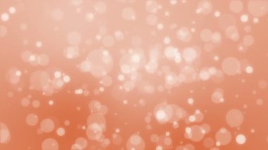 Hareket eden ışık parçacıkları ile parlayan turuncu bokeh arkaplan.