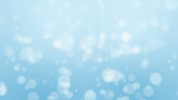 Fond bleu clair animé de bokeh d'hiver avec des particules lumineuses lumineuses flottantes .