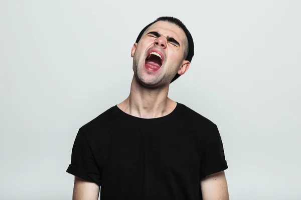 Screaming man in black t-shirt — Stock Photo, Image