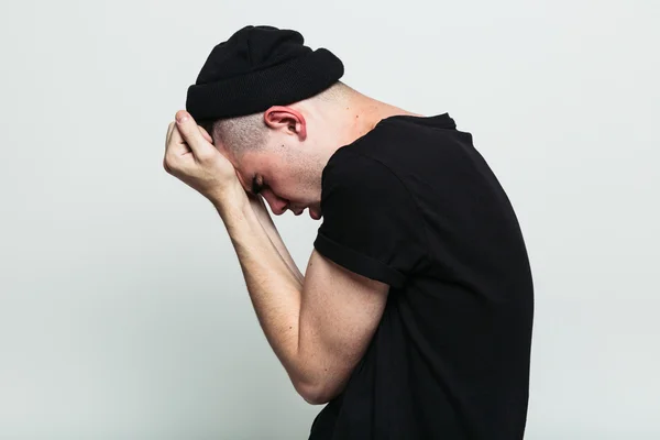 Side view of emotional man posing in studio — Stock Photo, Image