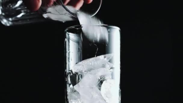 Glass is poured with water — Stock Video