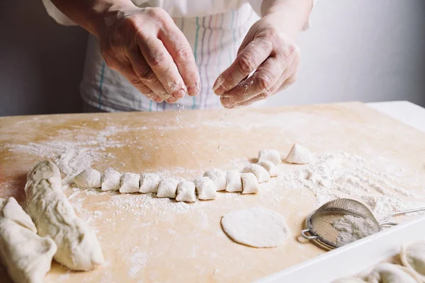 Two hands making dough for meat dumplings. — Stock Photo, Image