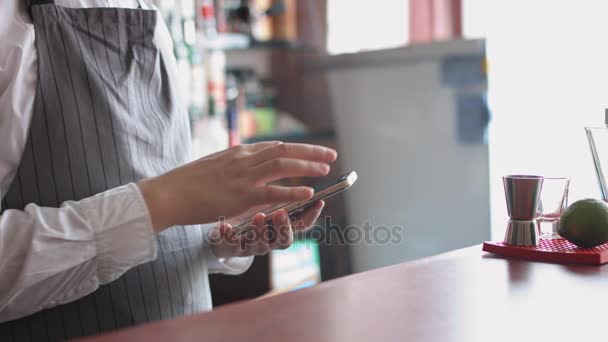 Bartender with mobile phone — Stock Video