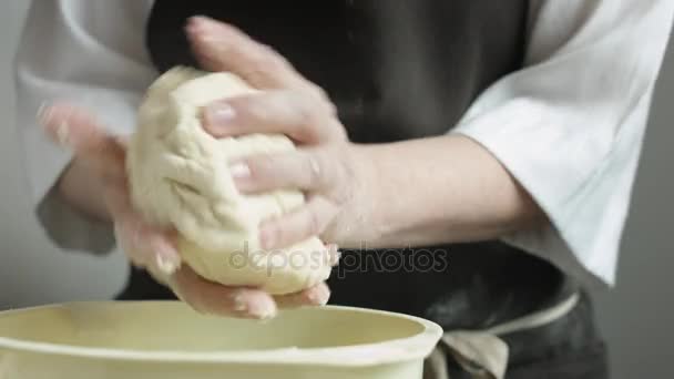 Chef kneads a large dough piece — Stock Video