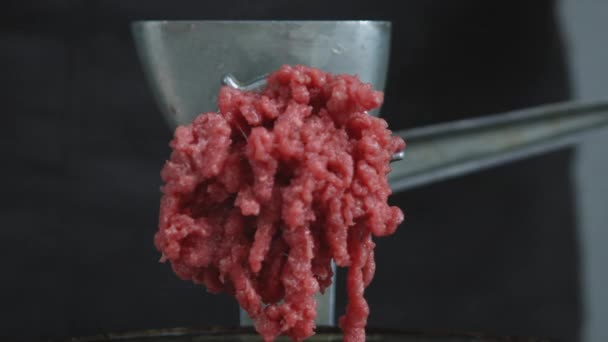 Close up of freshly ground meat coming out of a meat grinder. — Stock Video