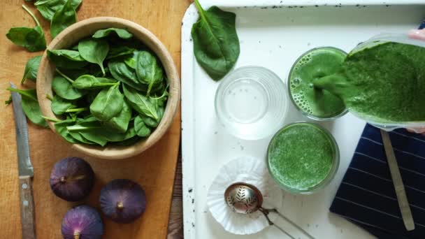 Person pours the smoothie in glass — Stock Video