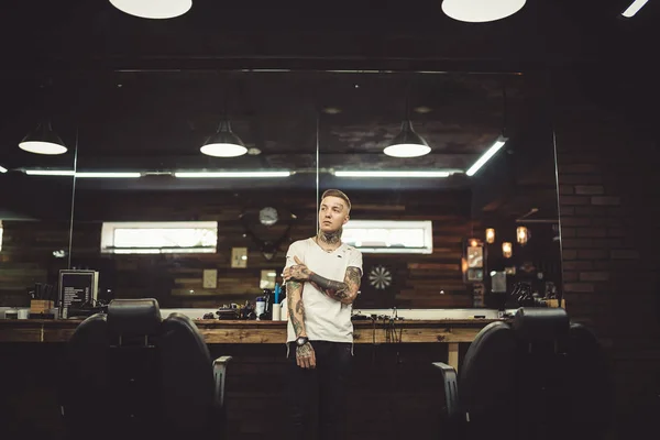 Portrait of tattooed barber — Stock Photo, Image