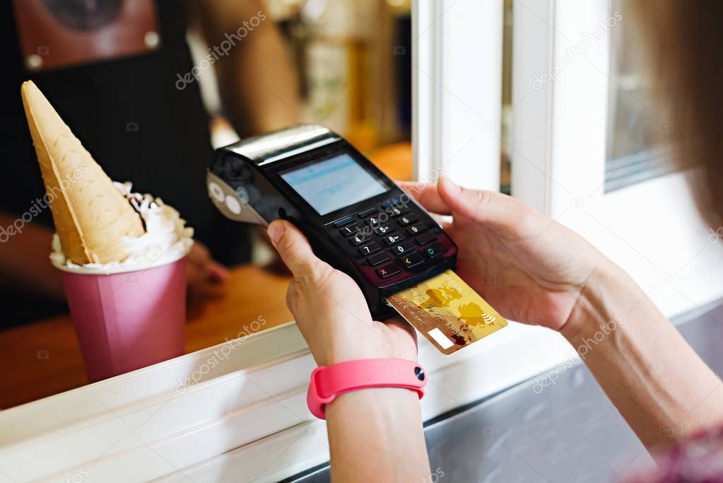 Person paying bill in cafe
