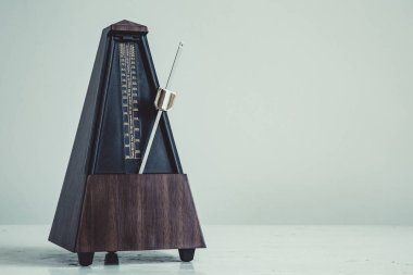 Color shot of a vintage metronome clipart