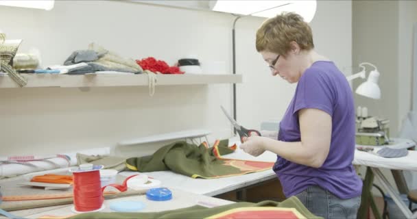 Seamstress works on a garment — Stock Video