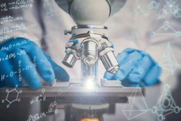 Close-up shot of microscope with metal lens at laboratory. — Stock Photo, Image