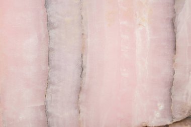 Aydınlatılmış mermer akik. Yatay görüntü. Sıcak pembe renkler. Güzel yakın plan