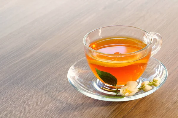 Tea with lemon and jasmine flowers — Stock Photo, Image