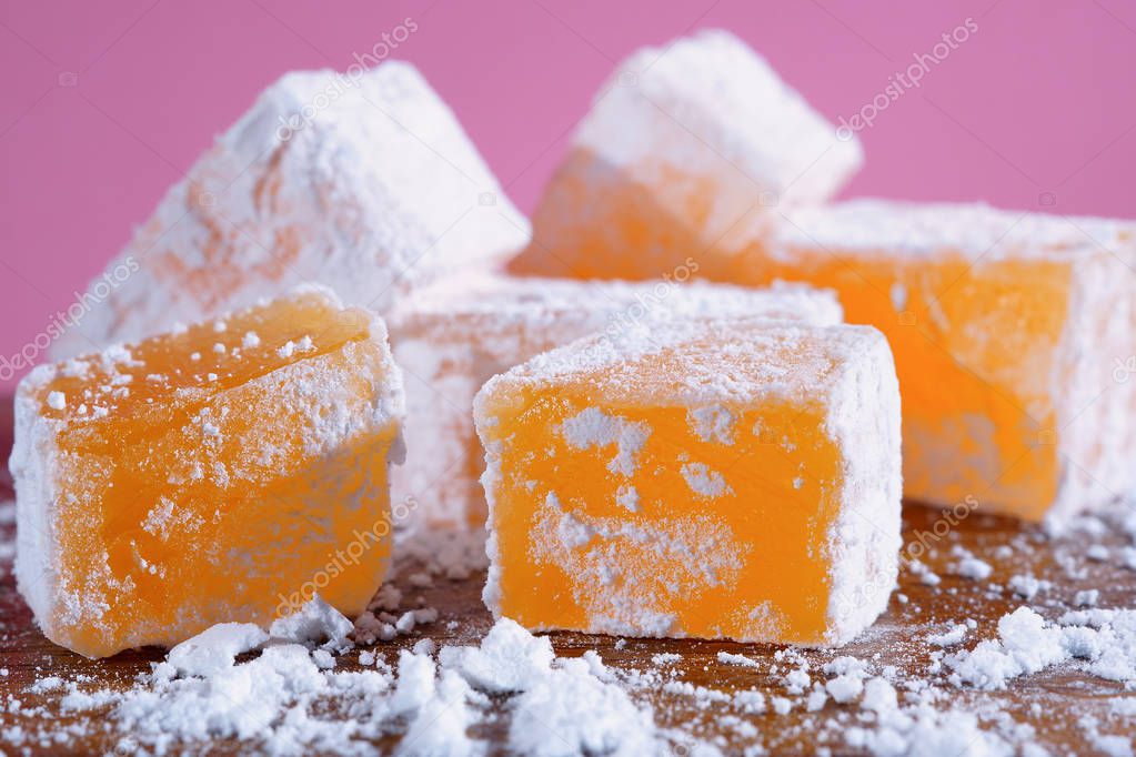 Orange Turkish delight. Eastern sweets closeup.