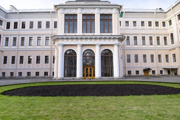 Manor with a lawn in one of the courtyards of St. Petersburg