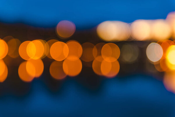 Colorful defocused bokeh abstract background created by city night lights.
