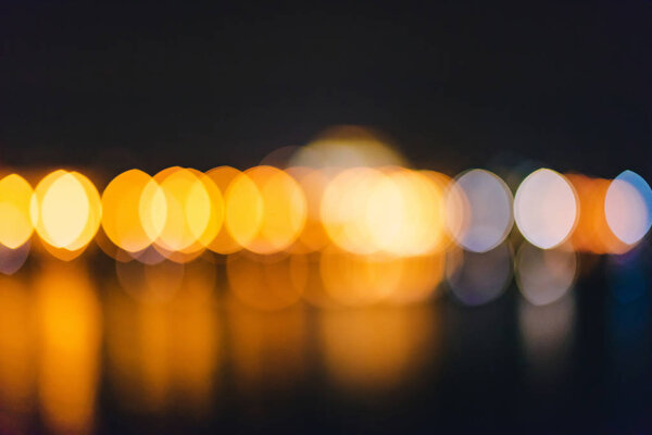 Colorful defocused bokeh abstract background created by city night lights.