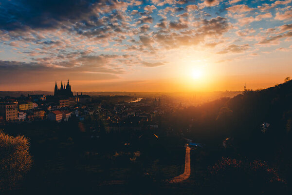 Panorama of Prague in the morning. European city on the sunrise. Baroque and gothic architecture silhouette.