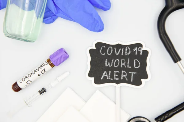 Text phrase: COVID 19, WORLD ALERT, with medical equipment on white background. Novel coronavirus 2019-nCOV, MERS-Cov middle East respiratory syndrome coronavirus.