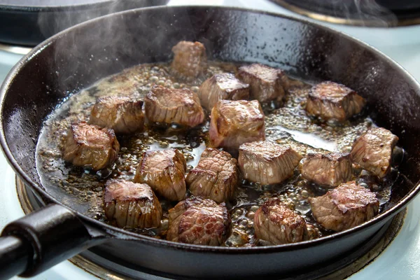 Frying beef bottom round roast cubes — Stock Photo, Image