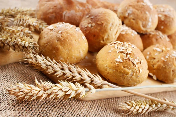 Homemade buns with wheat ears — Stock Photo, Image