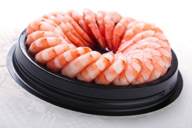 Shrimp ring on plastic platter clipart