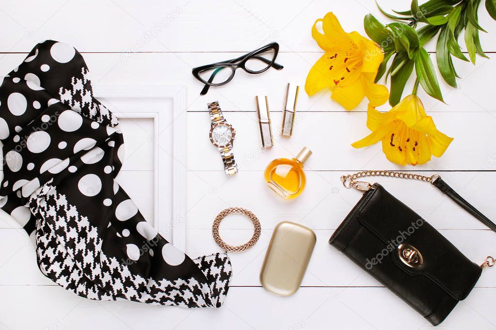 fashion scarf, perfume, glasses, and flowers on white background